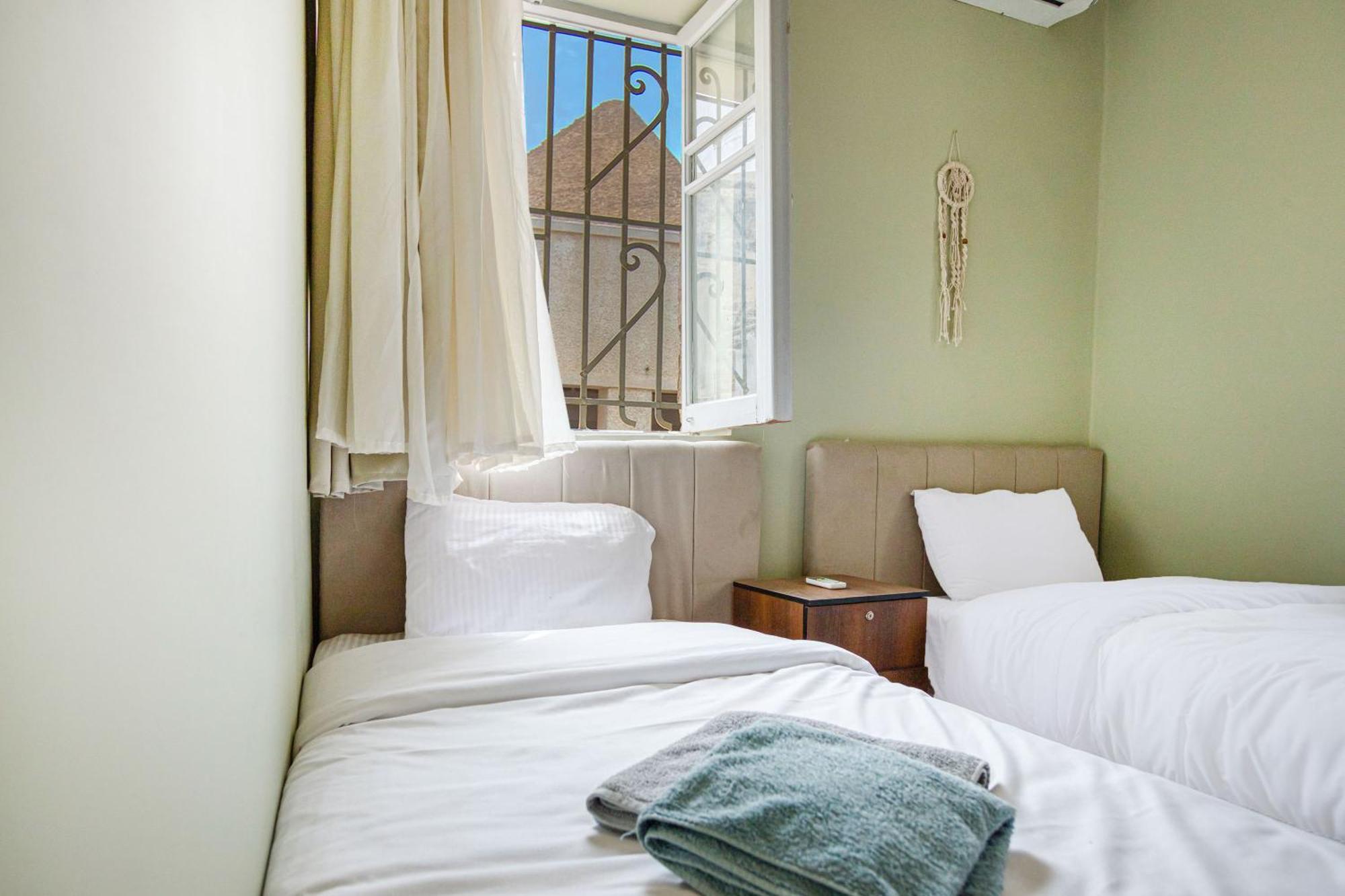 The Grand Pyramids View Hotel Kafret el-Gabal Zimmer foto